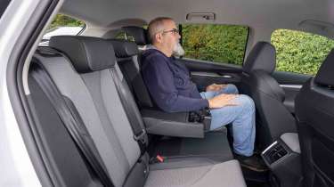 Skoda Enyaq - rear seats with senior test editor, Dean Gibson